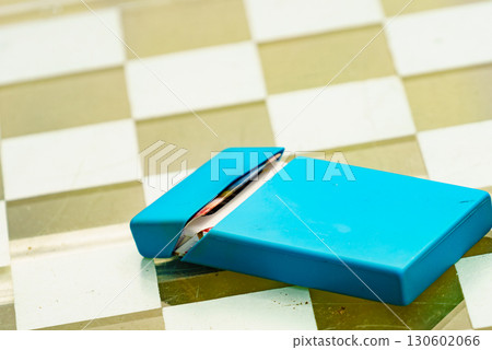 Cigarette pack on table Cigarette pack on table 130602066