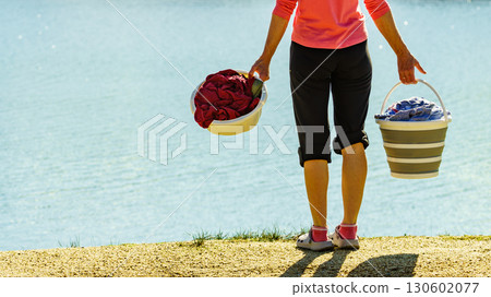 Female washing laundry on holidays trip. Female washing laundry on holidays trip. 130602077