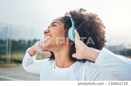 Freedom, fitness and music for black woman training at court, happy and relax with wellness track. Sports, podcast and girl smile with radio, playlist or song during exercise and workout Freedom, fitness and music for black woman training at court, happy and relax with wellness track. Sports, podcast and girl smile with radio, playlist or song during exercise and workout 130602130