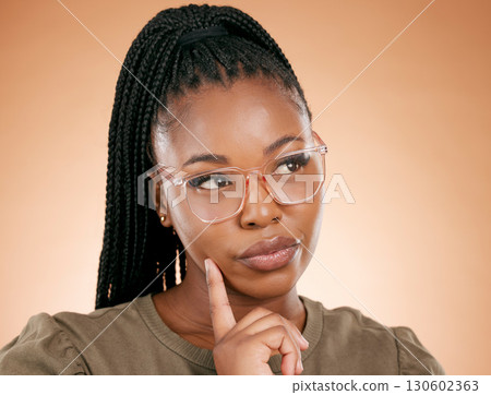 Thinking, black woman and glasses of a young female business professional in a studio. Studio background, isolated and idea vision of a creative employee with eye care and ideas for designer strategy 130602363