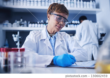 Black woman, science documents and writing in laboratory for healthcare planning, review or checklist. Scientist, paperwork report and medical research of investigation, results or chemistry analysis 130602459