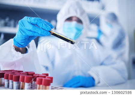 Science, test tube or doctor in laboratory with blood DNA for research, medical exam and sample analysis. Healthcare, biotechnology or scientist for medicine results study or vaccine report with PPE Science, test tube or doctor in laboratory with blood DNA for research, medical exam and sample analysis. Healthcare, biotechnology or scientist for medicine results study or vaccine report with PPE 130602586
