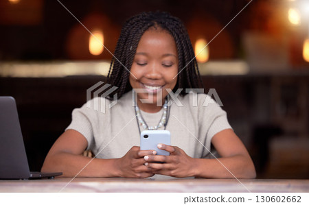 Black woman, phone and smile for social media, communication or chatting and texting at cafe. Happy African American female freelancer smiling for wifi on mobile app, browsing or chat on smartphone 130602662