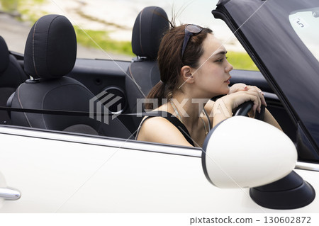 Cute woman driving 130602872