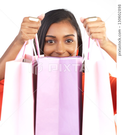 Retail, Indian woman portrait and shopping bag from discount sale or fashion promotion. Happy customer, gen z female model and clothes product deal with paper bags after designer sales in studio 130602898