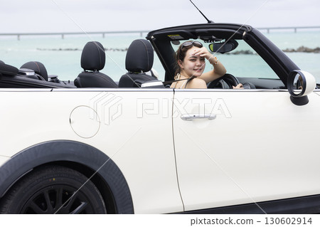 Cute woman driving 130602914