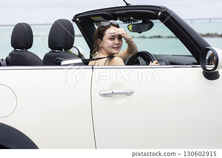 Cute woman driving 130602915