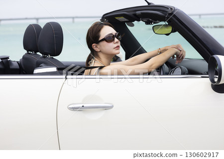 Cute woman driving 130602917