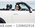 Cute woman driving 130602918