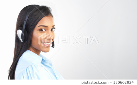 Customer support, call center and portrait of a Indian woman with mockup studio. Telemarketing, crm and empoyee work conversation with a smile from web help sale consultation online with mock up 130602924