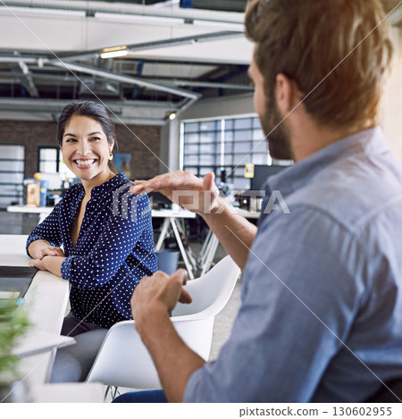 Office, talking and business man and woman in meeting, smile and in conversation working together. Communication, teamwork and happy workers in discussion, chat and brainstorming ideas in workplace 130602955