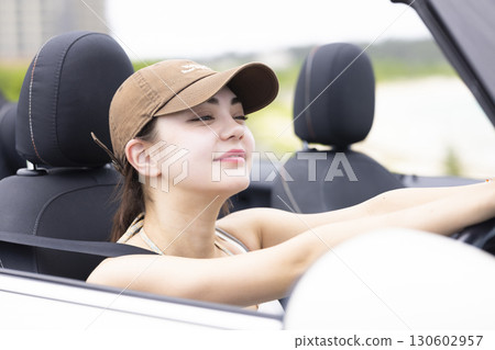 Cute woman driving 130602957