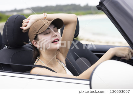 Cute woman driving 130603007