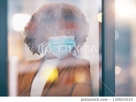 Covid, window and thinking with a business black woman in her office, standing by a glass pane alone. Idea, safety and mask with a female employee in her workplace during the corona virus pandemic Covid, window and thinking with a business black woman in her office, standing by a glass pane alone. Idea, safety and mask with a female employee in her workplace during the corona virus pandemic 130603033