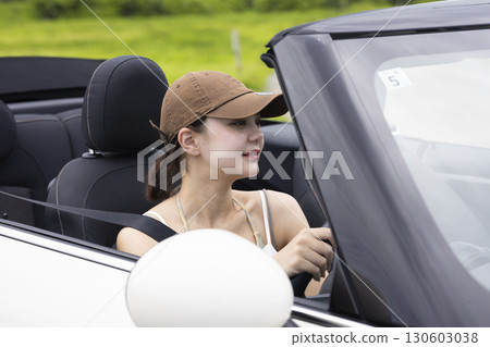 Cute woman driving 130603038