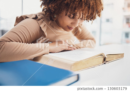 Religion, faith and woman reading the bible for knowledge, learning or worship in a house. Believe, god and christian African female studying the holy book for spiritual wellness or hope in her home. 130603179