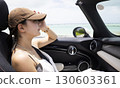 Cute woman in the passenger seat 130603361