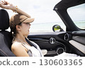 Cute woman in the passenger seat 130603365