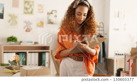 Fashion designer, checklist and logistics boxes, commerce and retail management of stock or inventory. Entrepreneur, seller or business woman writing notes, clipboard or documents for courier invoice Fashion designer, checklist and logistics boxes, commerce and retail management of stock or inventory. Entrepreneur, seller or business woman writing notes, clipboard or documents for courier invoice 130603377