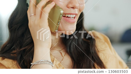 Phone communication, talking and asian woman at home on a sofa with a online conversation. Phone call, speaking and networking of a person on a mobile phone at a living room house on a couch 130603503