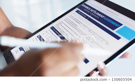 Tablet, divorce and closeup of digital document for signature in settlement or agreement. Tech, website and woman reading online website for legal, law or attorney paperwork for marriage separation. 130603504