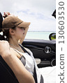 Cute woman in the passenger seat 130603530