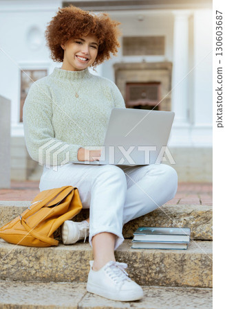 Laptop, university and portrait of a woman in the city sitting on the stairs studying for test or exam. Education, happy and female college student from Brazil working on academic project on computer 130603687