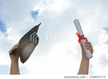 University, graduation and hands in sky with certificate to celebrate success in college education. Learning, knowledge and winning future, celebration of studying achievement and graduate class win 130603713