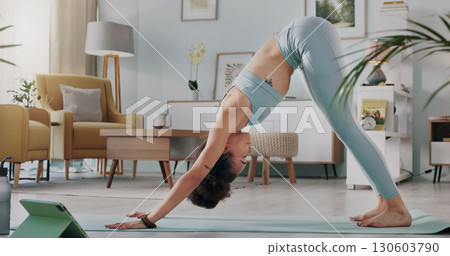 Woman, yoga and stretching body in fitness, exercise or zen workout for spiritual wellness in living room at home. Calm female person or yogi in warm up or training for health and awareness on mat 130603790