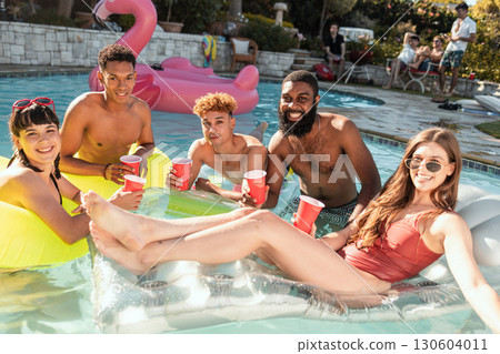 Beer, pool party and friends selfie, having fun and partying on new year. Summer celebration, water event and group portrait of people taking pictures for social media, swimming or floating on float. Beer, pool party and friends selfie, having fun and partying on new year. Summer celebration, water event and group portrait of people taking pictures for social media, swimming or floating on float. 130604011