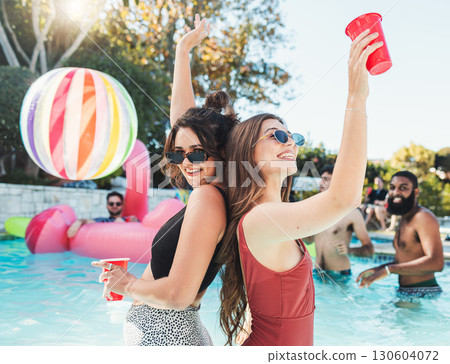 Fun, drink and portrait of friends at a pool party for swimming, celebration and vacation in summer. Playful, alcohol and women in the water on a tropical group holiday for a break to celebrate life Fun, drink and portrait of friends at a pool party for swimming, celebration and vacation in summer. Playful, alcohol and women in the water on a tropical group holiday for a break to celebrate life 130604072