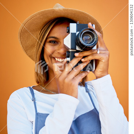 Portrait, photographer and black woman with camera, smile and creative against studio background. Face, African American female artist or lady with device, happiness or freelancer with casual clothes 130604132