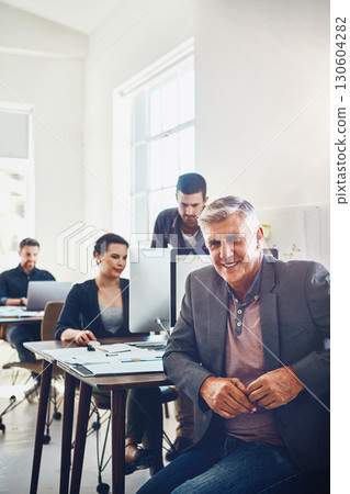Business, senior and portrait of man in office or company workplace. Leadership, ceo or happy elderly male employee or manager with coworkers working on marketing report, advertising or sales project Business, senior and portrait of man in office or company workplace. Leadership, ceo or happy elderly male employee or manager with coworkers working on marketing report, advertising or sales project 130604282