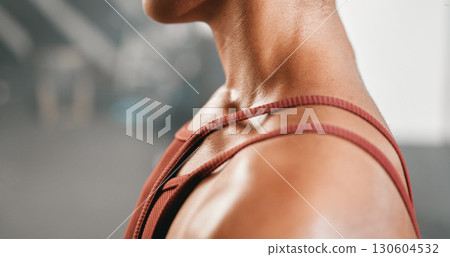 Woman closeup and shoulder muscle at gym for fitness, training or workout for body definition. Arm, girl and zoom in on sports athlete during health, exercise and cardio for healthy lifestyle Woman closeup and shoulder muscle at gym for fitness, training or workout for body definition. Arm, girl and zoom in on sports athlete during health, exercise and cardio for healthy lifestyle 130604532