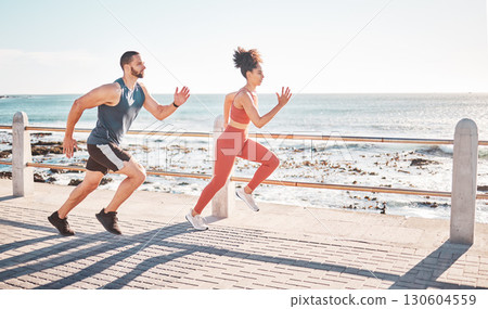 Runner, fitness and sea with a sports couple outdoor during summer for cardio or endurance exercise. Health, training and ocean with a man and woman running on a promenade for a workout together 130604559