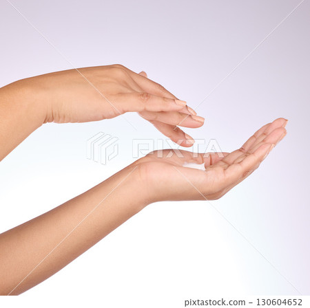 Hands, moisturizer and beauty, skincare and woman, manicure and nail polish with cosmetics on studio background. Sunscreen, lotion application and dermatology with cream cosmetic product and female Hands, moisturizer and beauty, skincare and woman, manicure and nail polish with cosmetics on studio background. Sunscreen, lotion application and dermatology with cream cosmetic product and female 130604652