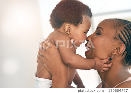 Smile, touch and nose with mother and baby for bonding, affectionate and connection in family home. Kindness, happiness and happy with black woman holding child for positive, growth and support Smile, touch and nose with mother and baby for bonding, affectionate and connection in family home. Kindness, happiness and happy with black woman holding child for positive, growth and support 130604757