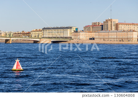 A scenic view of Neva river with a red marker buoy in the foreground 130604808