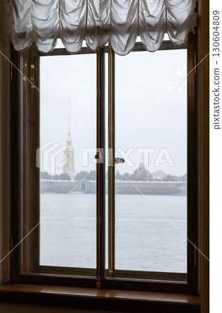 A peaceful view of a river and distant landmarks of Saint-Petersburg A peaceful view of a river and distant landmarks of Saint-Petersburg 130604809
