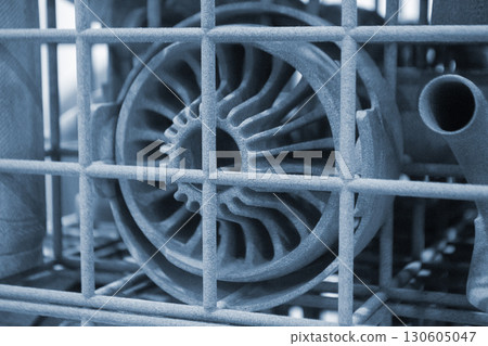 Object printed on 3D printer from molten plastic powder close-up. Model printed on 3D printer from melted polyamide powder. New modern additive 3D printing technology. Multi Jet Fusion MJF technology 130605047