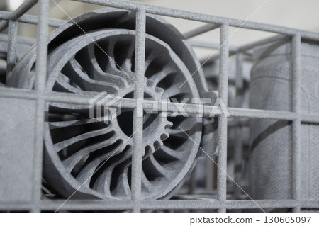 Object printed on 3D printer from molten plastic powder close-up. Model printed on 3D printer from melted polyamide powder. New modern additive 3D printing technology. Multi Jet Fusion MJF technology 130605097