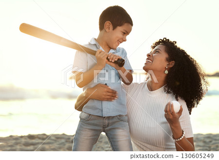 Beach, baseball and a black family with children playing sports together by the ocean or sea at sunset. Kids, love or sport with a mother and son on the sand to play a game while bonding in summer Beach, baseball and a black family with children playing sports together by the ocean or sea at sunset. Kids, love or sport with a mother and son on the sand to play a game while bonding in summer 130605249