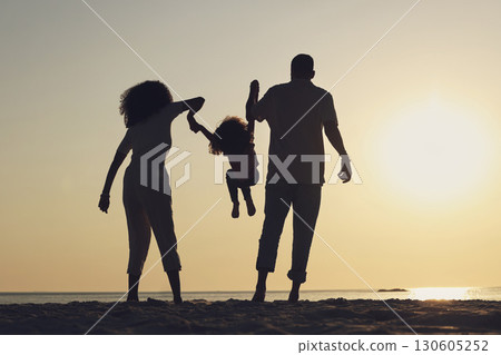 Silhouette, beach and a family with children by the ocean, playing together in nature at sunset from the back. Summer, travel or love with a mother, father and kid having fun while bonding at the sea Silhouette, beach and a family with children by the ocean, playing together in nature at sunset from the back. Summer, travel or love with a mother, father and kid having fun while bonding at the sea 130605252