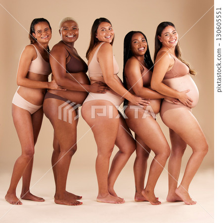 Portrait, pregnant and happy women in row on studio background in community, diversity or baby support group. Smile, happy or bonding mothers with pregnancy stomach, underwear or healthcare wellness 130605551