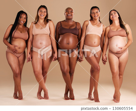Pregnant, women or portrait of holding hands in support, body empowerment or studio background community. Happy smile, pregnancy or friends underwear for belly growth, diversity pride or mothers day 130605554