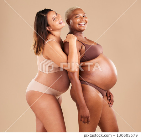Pregnant, bonding or laughing women on studio background in body empowerment, support or community. Happy smile, diverse or pregnancy friends in underwear and fun joke, baby or family planning mockup Pregnant, bonding or laughing women on studio background in body empowerment, support or community. Happy smile, diverse or pregnancy friends in underwear and fun joke, baby or family planning mockup 130605579