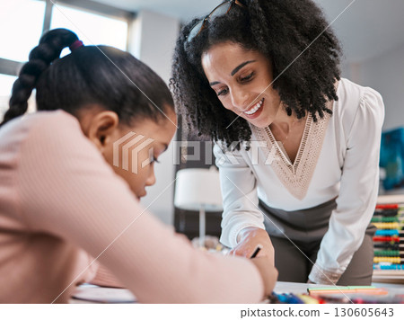 Writing, education or teacher helping a girl in a classroom with learning development or studying notes. Kid, notebook or happy black woman smile teaching or talking to a focused high school student 130605643