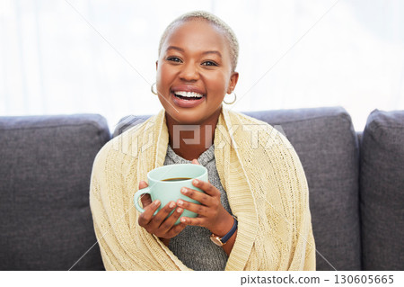 Black woman, portrait and sofa with coffee, smile or relax in home living room for me time. Young African lady, drink or tea on couch for happiness, self care and chilling in house, apartment or room 130605665