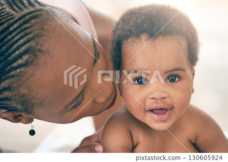 Mother with baby, face and hug with family, content and bonding with love and early childhood, female and happiness. Black woman, mom holding child with parenting, motherhood and cuddle with care 130605924