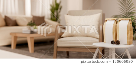 An armchair and round stool table with coffee bean bags and acorn in the living room. Cosy Interior. 130606080